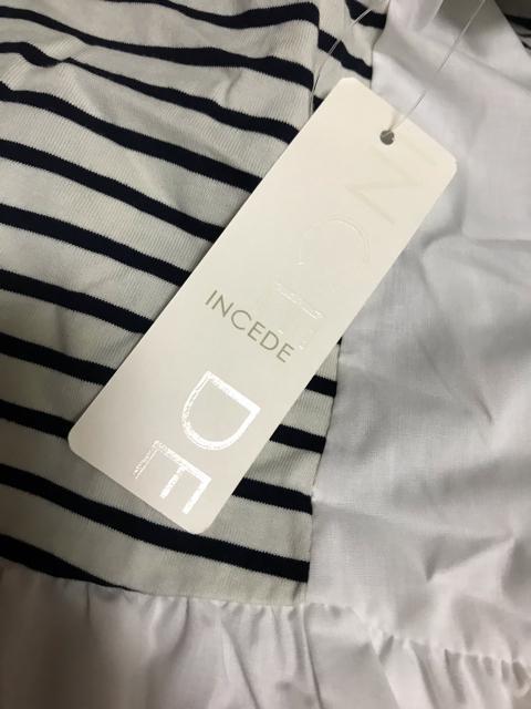 新品タグ付き 異素材切り替えフリルヘムチュニック インシード L < 女性ファッション  新品タグ付き 異素材切り替えフリルヘムチュニック インシード L < 女性ファッションの