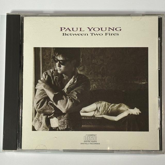 Paul Young / Between Two Fires  �� CD/DVD/�r�f�I�� 